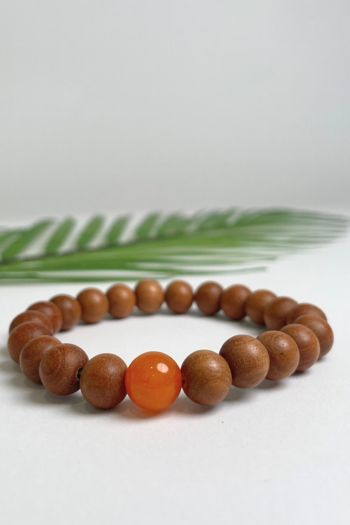 Sandalwood bracelets ethically made in Nepal - orange colour stone