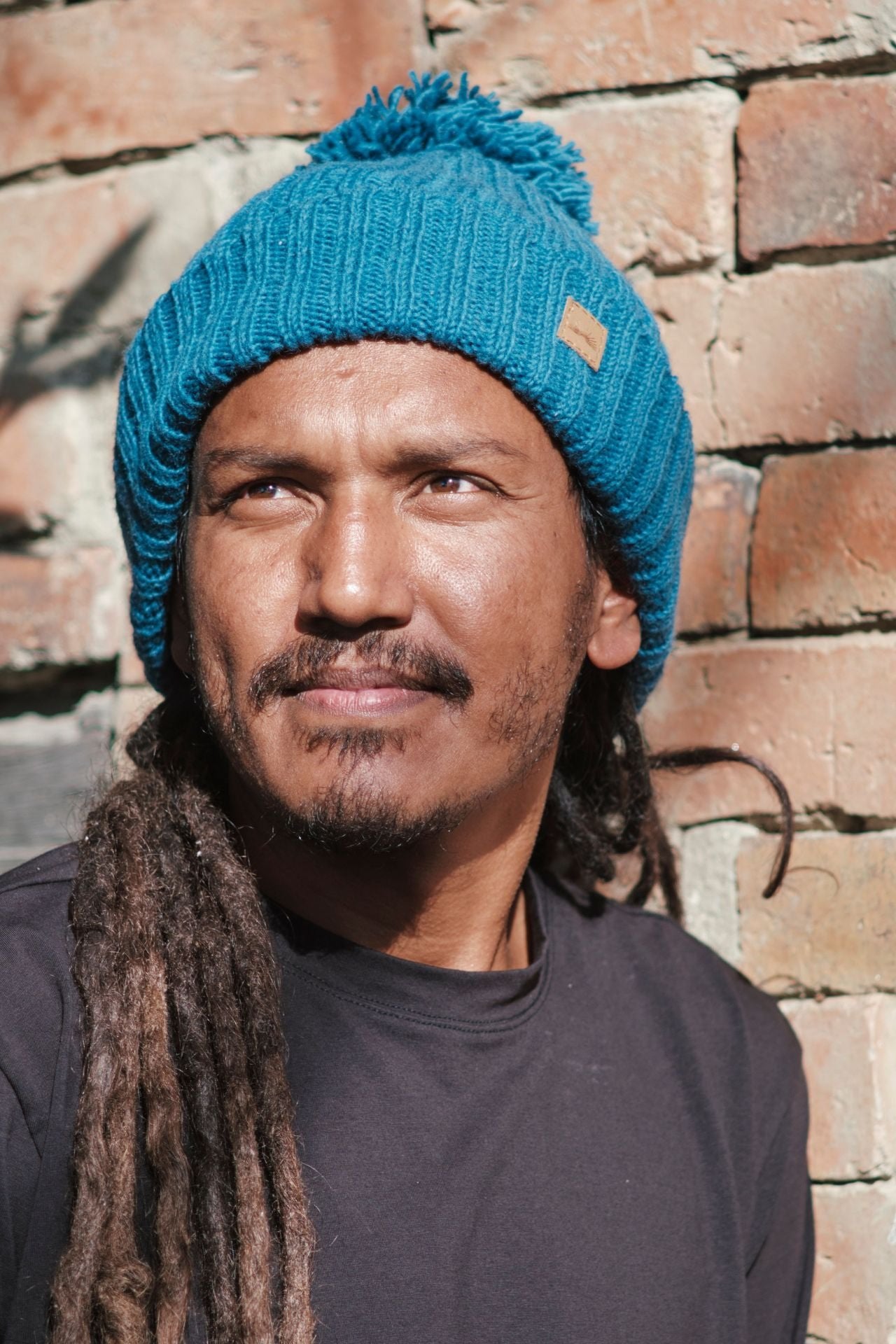 Surya Australia Ethical Wool Pompom Beanie for Men from Nepal - Blue