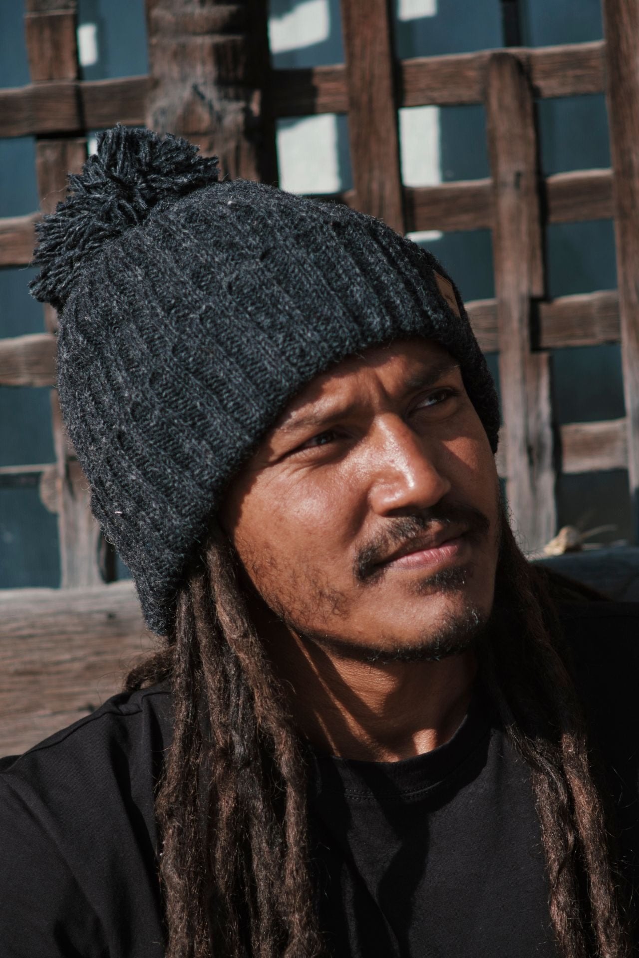 Surya Australia Ethical Wool Pompom Beanie for Men from Nepal - Charcoal