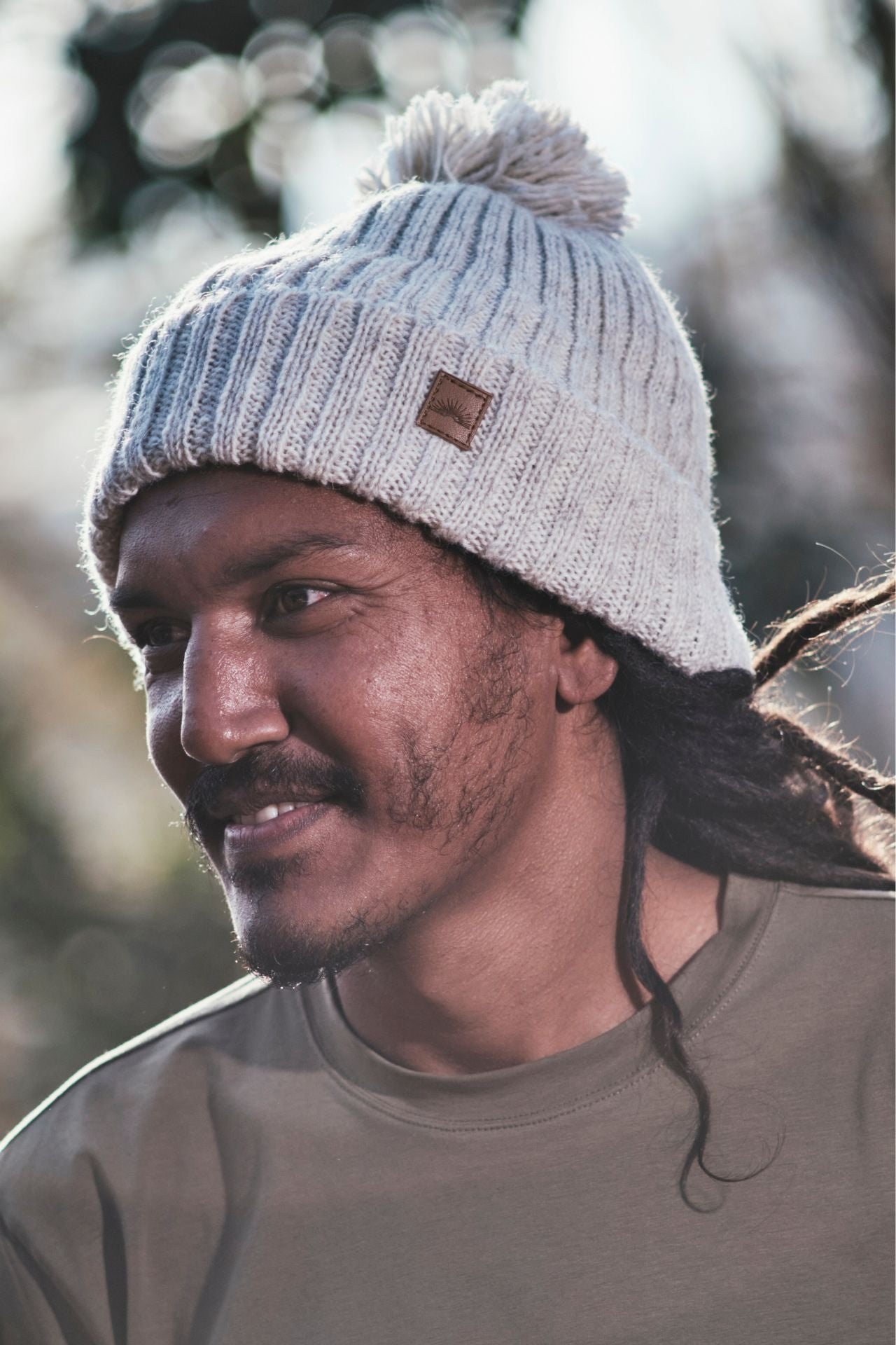 Surya Australia Ethical Wool Pompom Beanie for Men from Nepal - Oatmeal