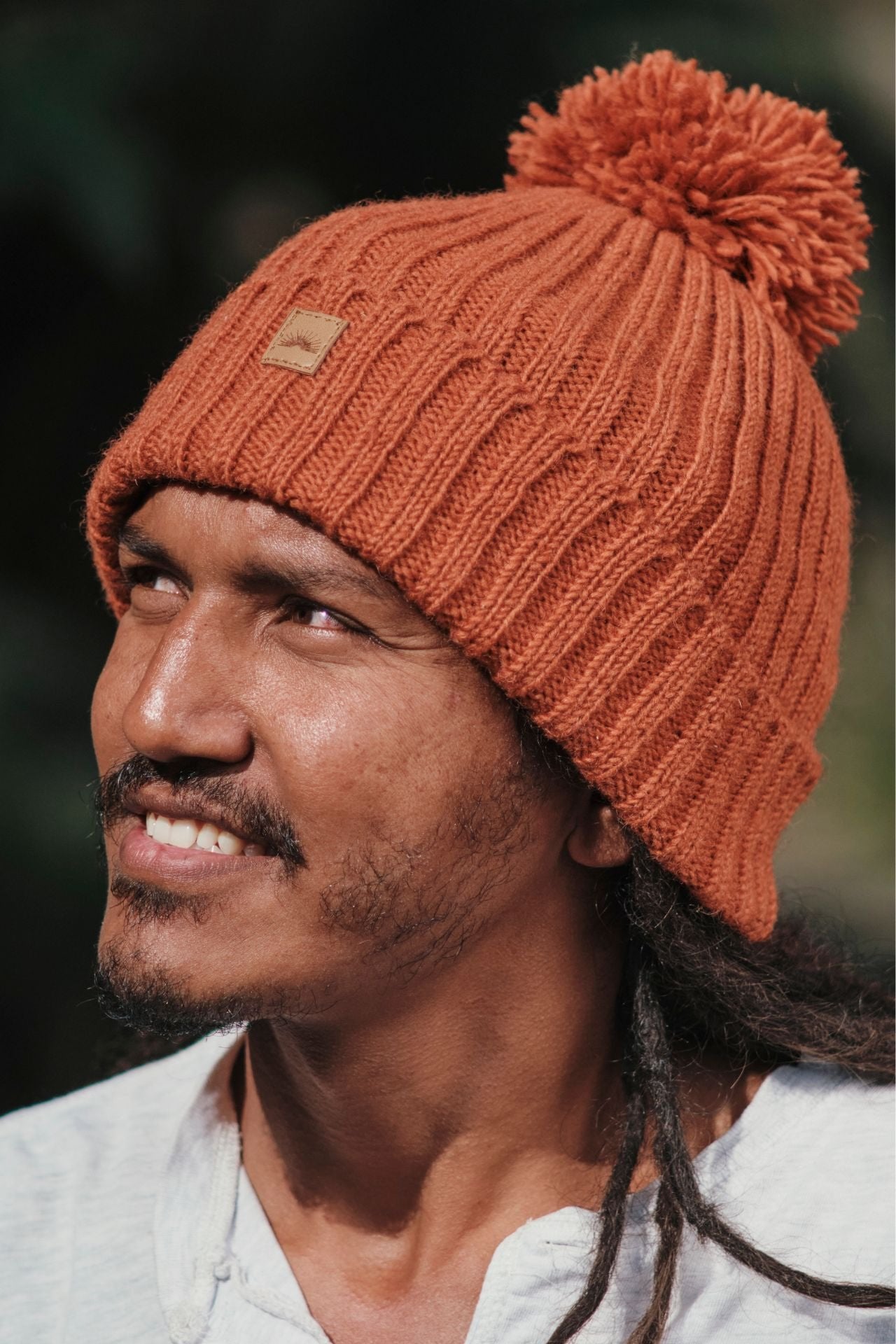 Surya Australia Ethical Wool Pompom Beanie for Men from Nepal - Burnt Orange