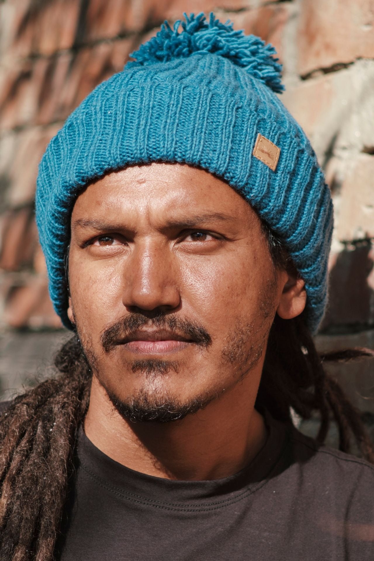 Surya Australia Ethical Wool Pompom Beanie for Men from Nepal - Blue