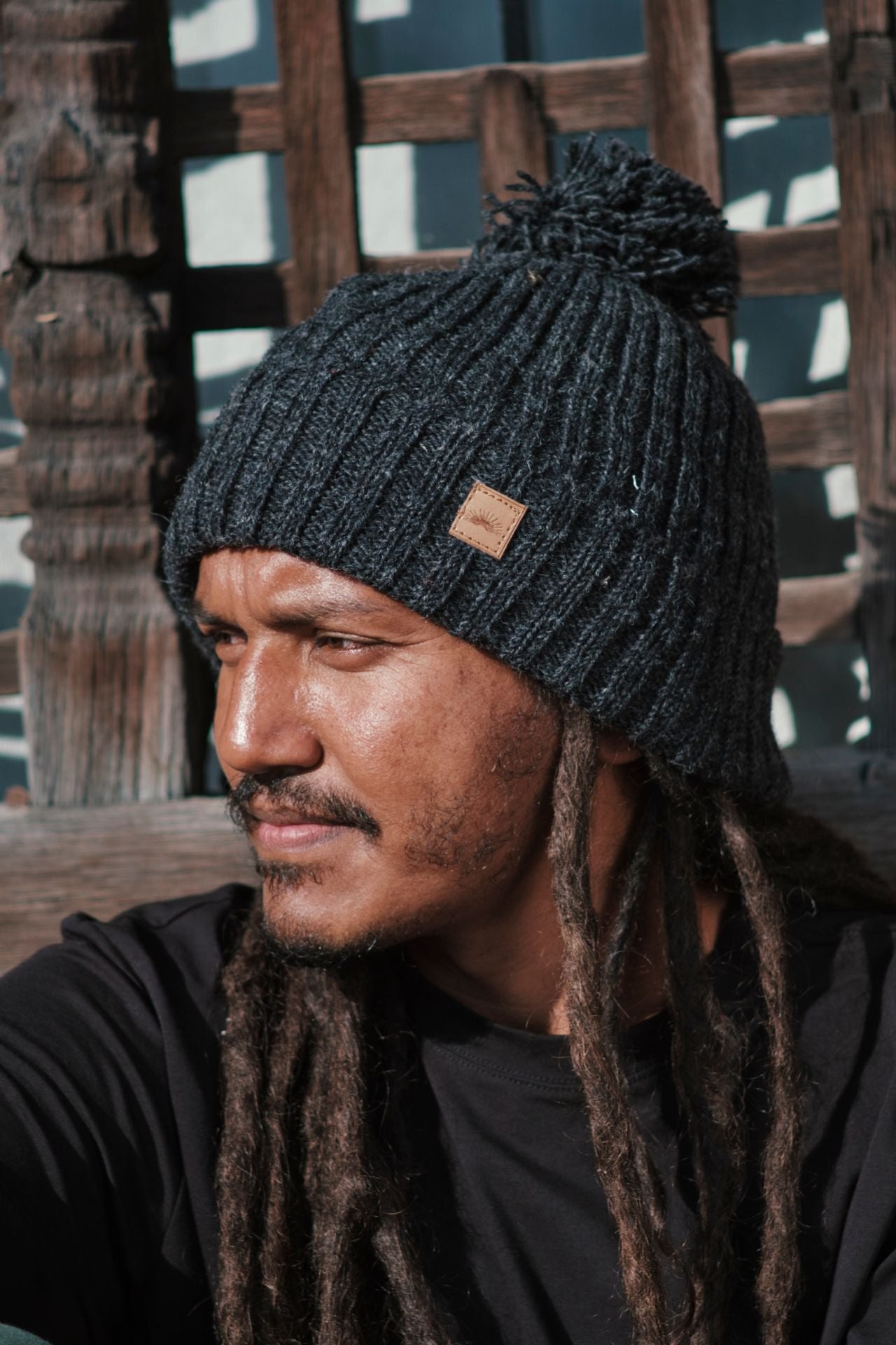 Surya Australia Ethical Wool Pompom Beanie for Men from Nepal - Charcoal