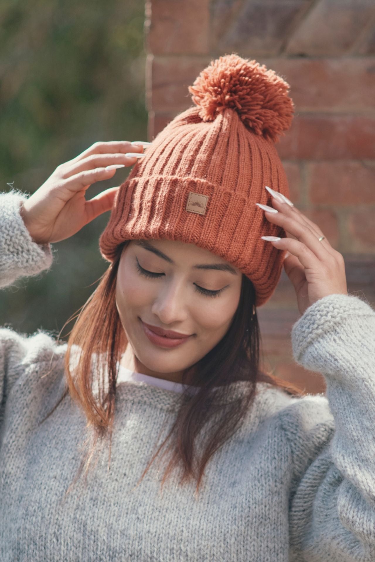 Surya Australia Wool 'Pompom' Beanie for women made in Nepal - Burnt Orange