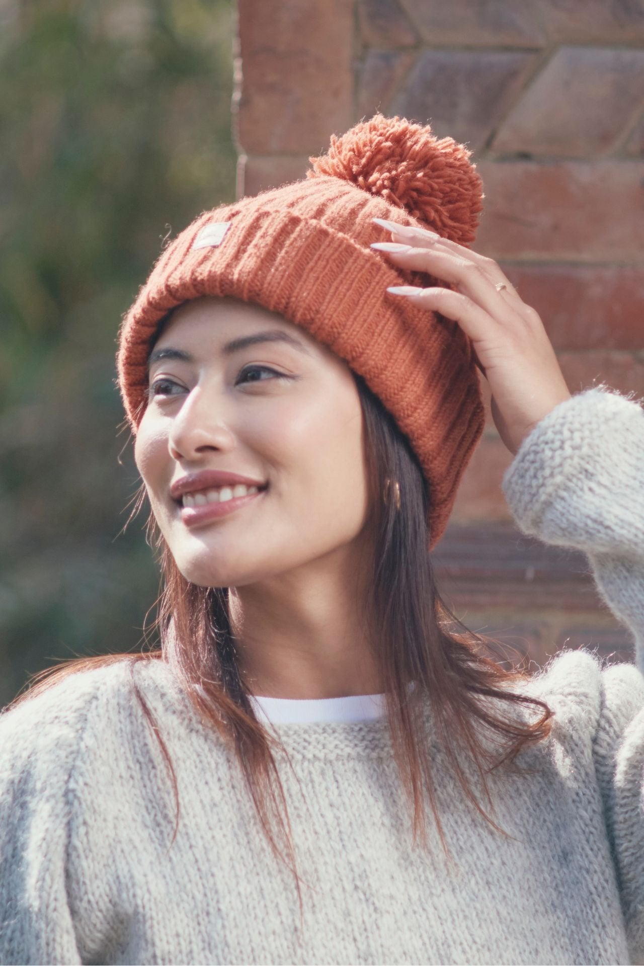 Surya Australia Wool 'Pompom' Beanie for women made in Nepal - Burnt Orange