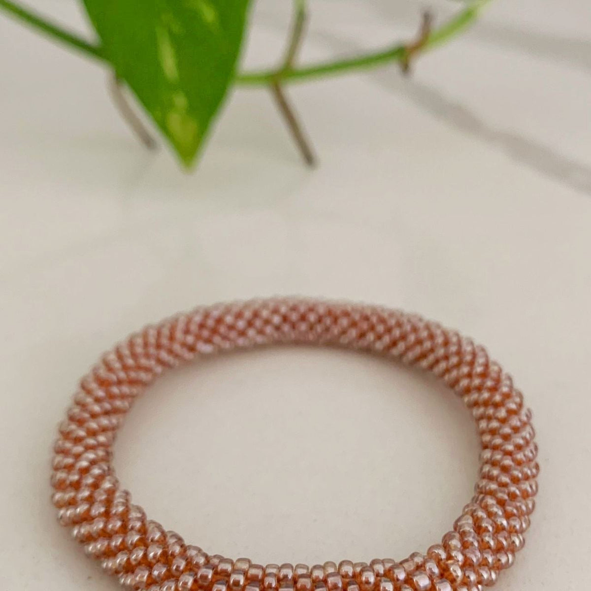 Ethical Rollon Glass Beaded Bracelet made in Nepal Gold Surya