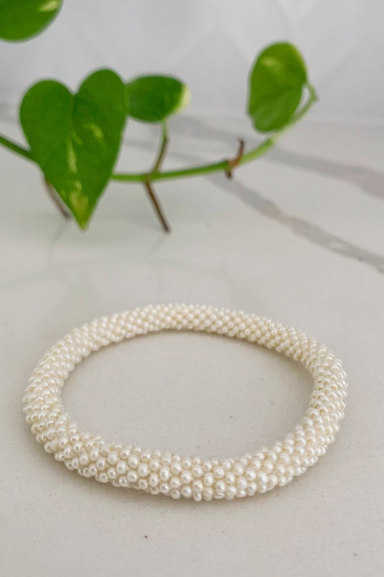 Surya Australia Ethical Roll-on Beaded Bracelet from Nepal - White