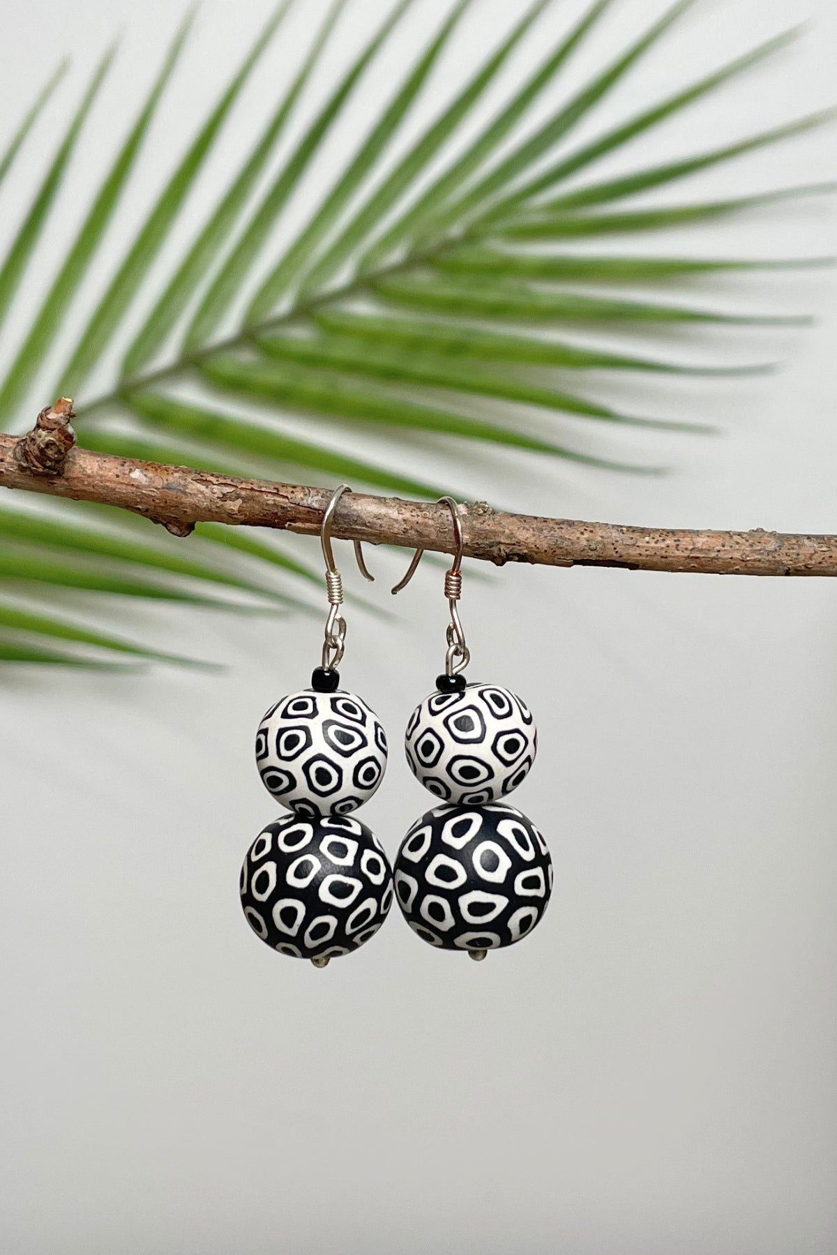 Double drop polymer clay earrings made in Nepal – Black + White