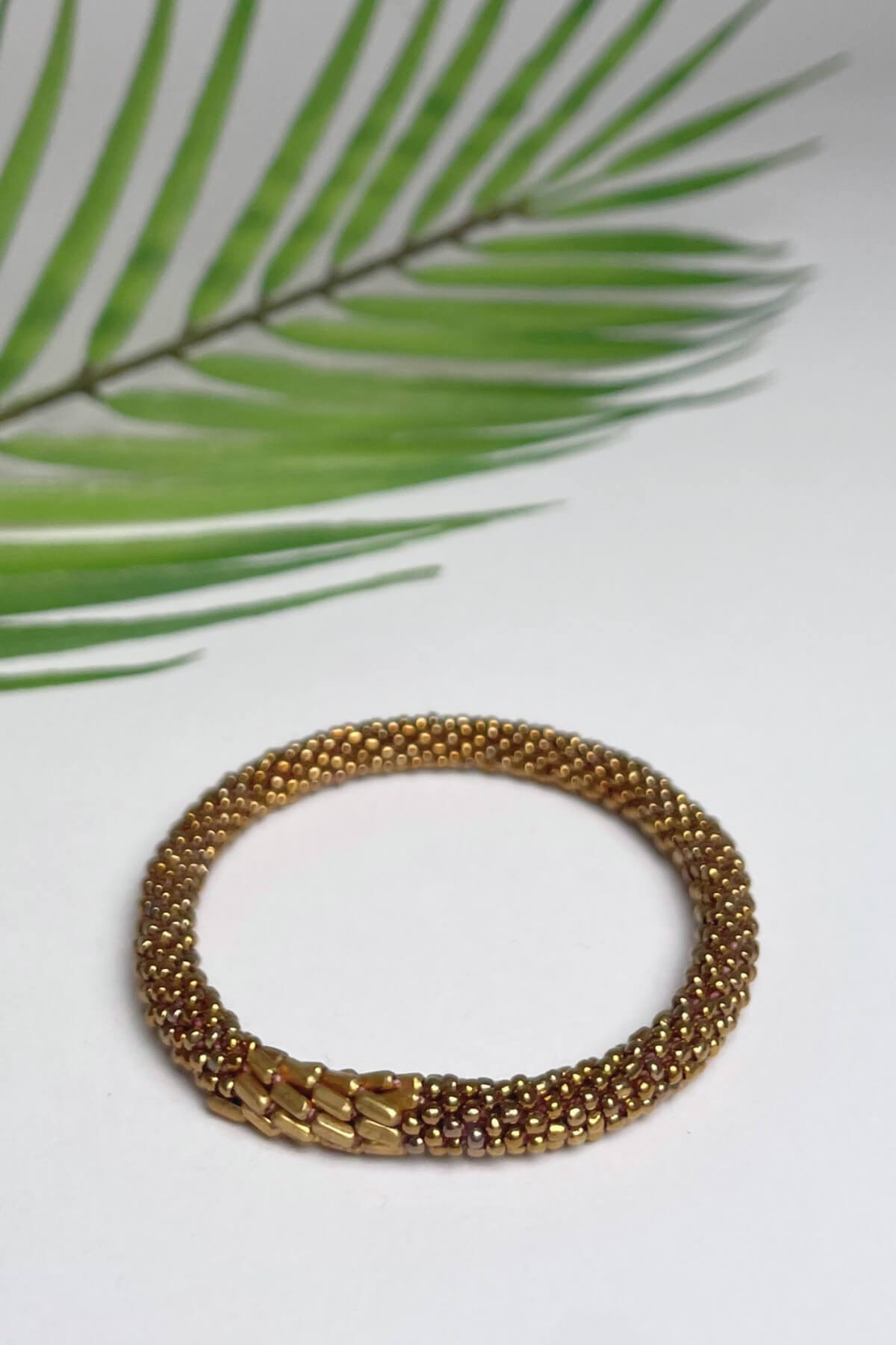 Ethical roll-on beaded bracelets made in Nepal – gold