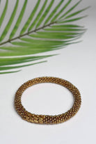 Ethical roll-on beaded bracelets made in Nepal – gold