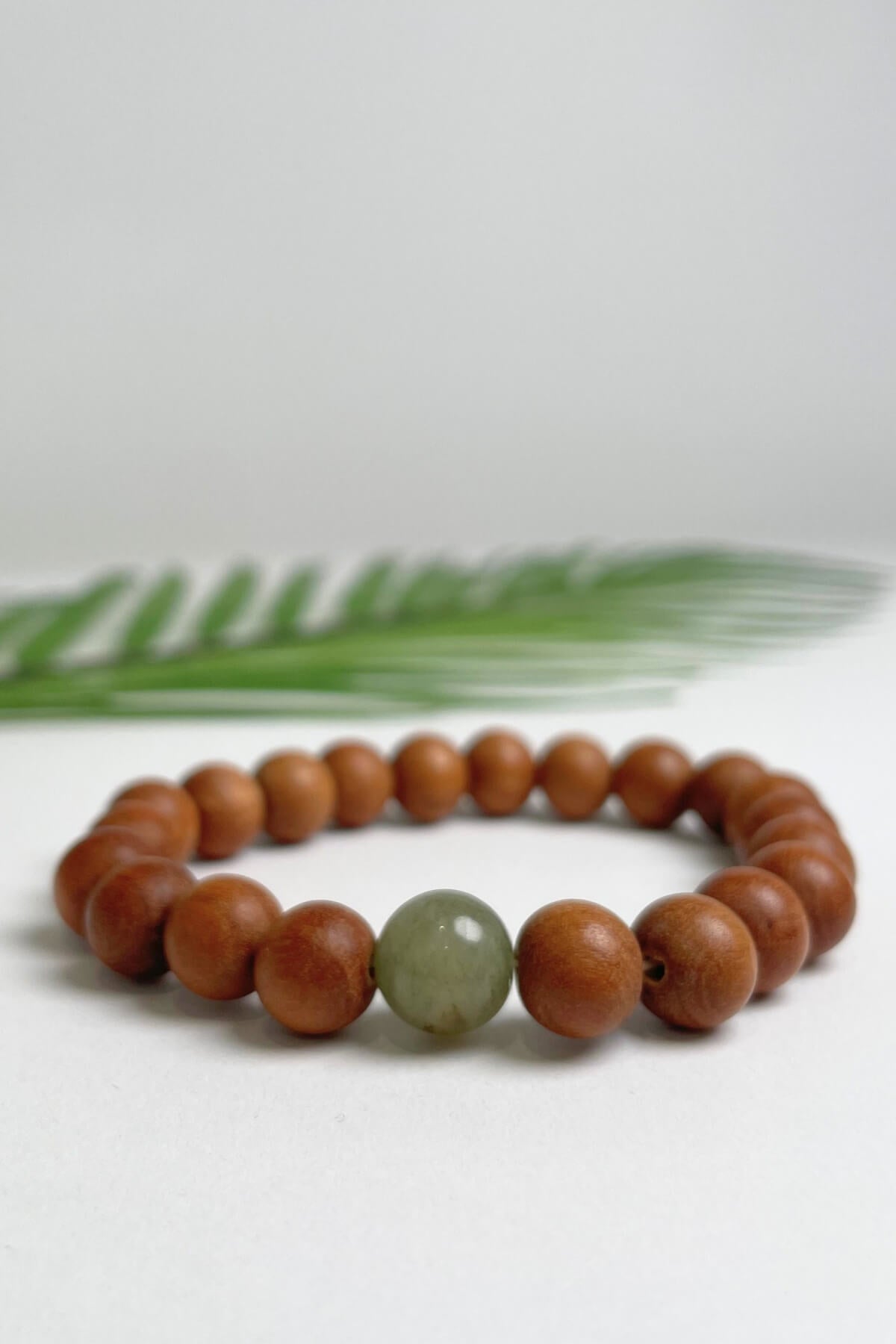 Sandalwood bracelets ethically made in Nepal - pale green colour stone