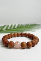 Sandalwood bracelets ethically made in Nepal - rose pink colour stone