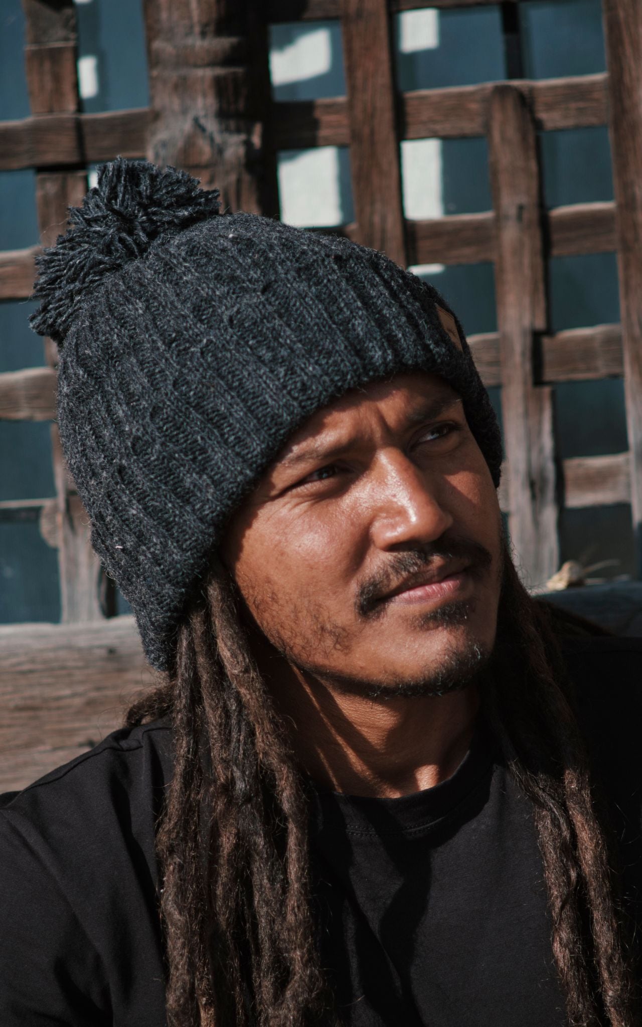 Surya Australia Ethical Wool Pompom Beanie for Men from Nepal - Charcoal
