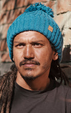 Surya Australia Ethical Wool Pompom Beanie for Men from Nepal - Blue