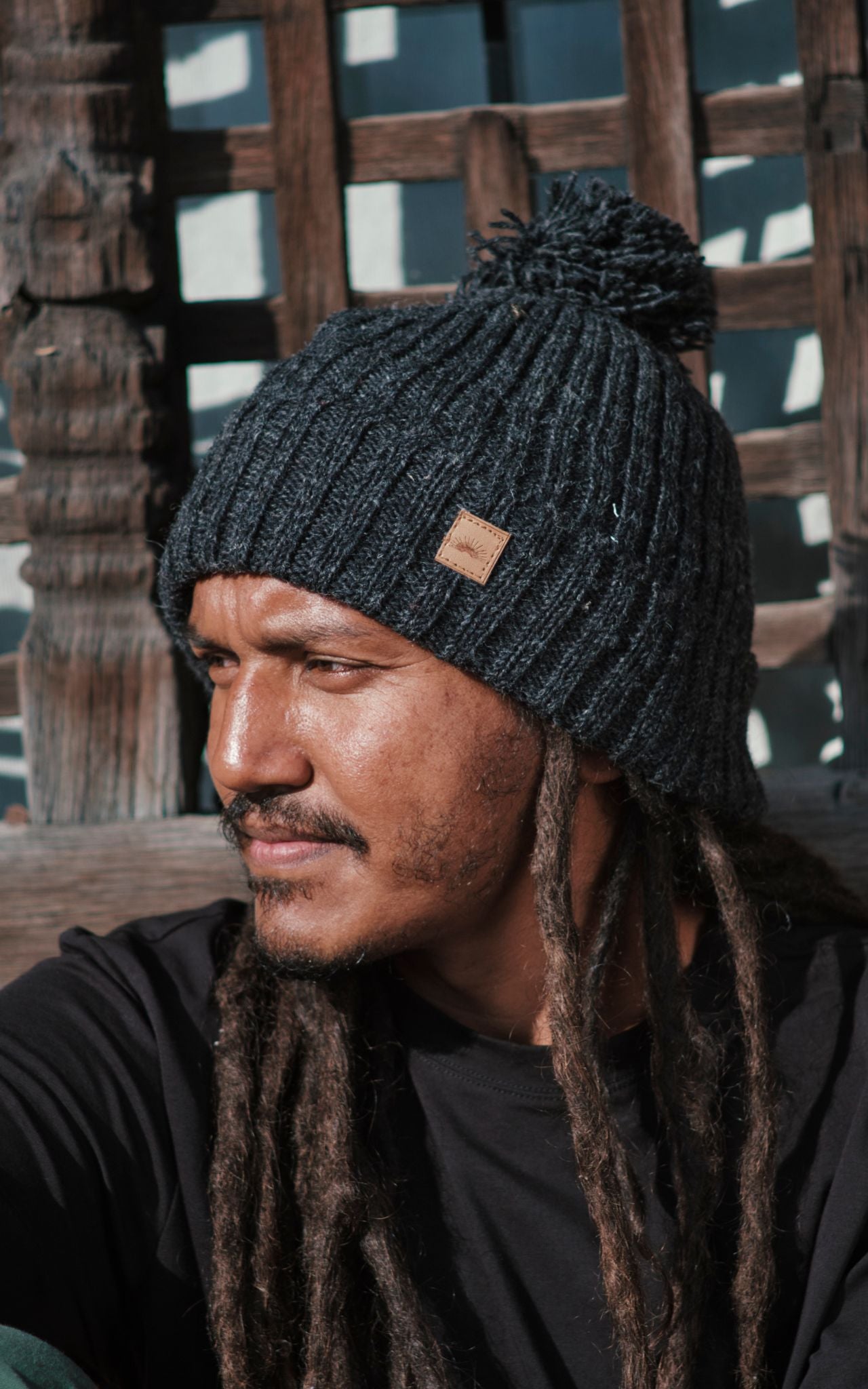 Surya Australia Ethical Wool Pompom Beanie for Men from Nepal - Charcoal