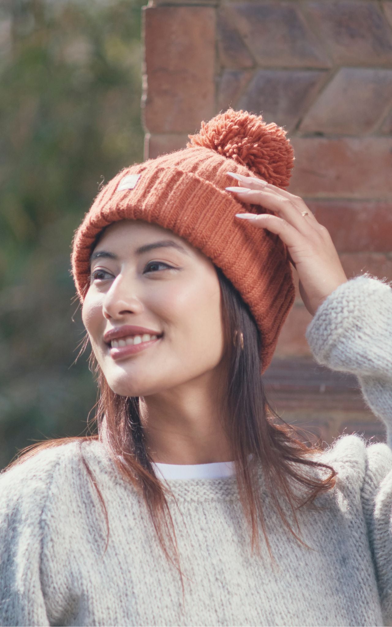 Surya Australia Wool 'Pompom' Beanie for women made in Nepal  - Burnt Orange