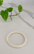 Surya Australia Ethical Roll-on Beaded Bracelet from Nepal - White