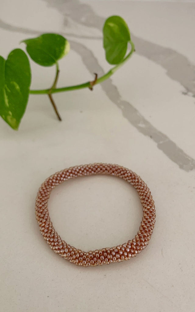 Surya Australia Ethical Roll-on Beaded Bracelet from Nepal - Gold