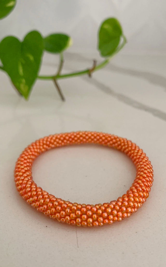 Surya Australia Ethical Roll-on Beaded Bracelet from Nepal - Orange
