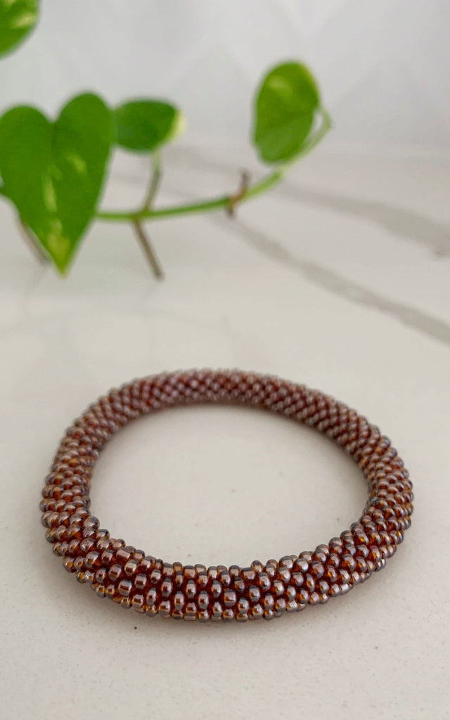 Surya Australia Ethical Roll-on Beaded Bracelet from Nepal - Rust