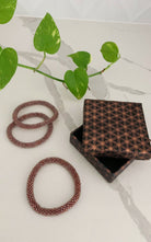 Surya Australia Ethical Roll-on Beaded Bracelet from Nepal - Rust 3 Pack